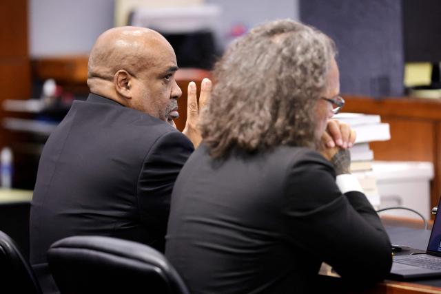 Duane Davis (L) and his attorney Michael Sanft listen to rebuttal closing arguments in the Duane Davis murder trial, related to the 1996 killing of rapper Tupac Shakur, at Clark County District Court at the Regional Justice Center in Las Vegas, Nevada, on August 31, 2026. The trial of the former gang leader accused of orchestrating the murder of rapper Tupac Shakur began on August 10, 30 years after one of America's most high-profile unresolved killings. The proceedings, expected to last a month, will likely not make clear who fired the shots that killed the California hip-hop legend on the night of September 7, 1996, while he was in Las Vegas to see a Mike Tyson boxing match. (Photo by STEVE MARCUS / POOL / AFP)