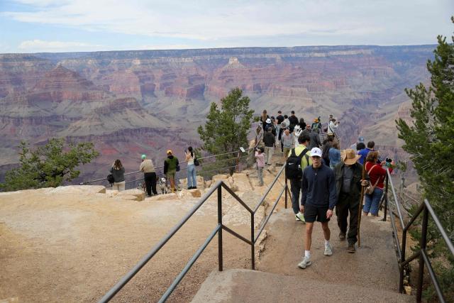 Visitors gather at a scenic overlook of the Grand Canyon, in Grand Canyon Village, Arizona, on August 31, 2026. More than 20 people may be missing after the flash flood in Grand Canyon National Park according to the National Park Service. The floods hit the Bright Angel Canyon and Phantom Ranch area on Saturday, the service said, adding that it was working with Arizona authorities to evacuate people and account for individuals in the affected area. (Photo by Ian Maule / AFP)