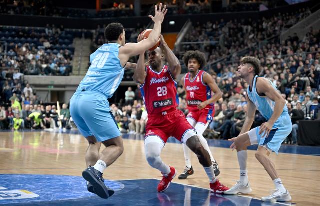 Puerto Rico's Ismael Romero (2nd L) is is defended by Uruguay's Pablo Gomez during the FIBA Basketball World Cup 2027 Americas qualifiers Group F match between Uruguay and Puerto Rico at the Antel Arena stadium in Montevideo on August 31, 2026. (Photo by Eitan ABRAMOVICH / AFP)