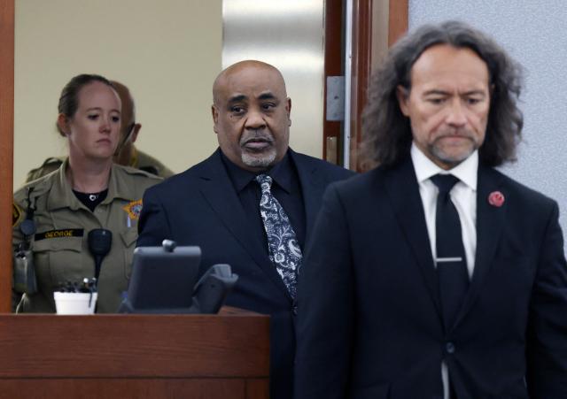 Duane Davis (C) and his attorney Michael Sanft are led back to a courtroom to hear his sentencing date after a jury found Davis guilty in the 1996 killing of rapper Tupac Shakur, at Clark County District Court at the Regional Justice Center in Las Vegas, Nevada, on August 31, 2026. Duane Davis, a former Los Angeles gang member, was found guilty on August 31 by a Las Vegas court of the 1996 murder of rapper Tupac Shakur. Thirty years after the rap legend's death at a Las Vegas casino, the jury found Davis, 63, guilty of murder after just a few hours of deliberation. (Photo by Bizuayehu TESFAYE / POOL / AFP)