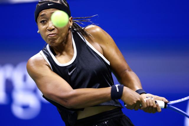 Japan's Naomi Osaka returns the ball to Russia's Anastasia Zakharova (off frame) during the women's singles first round tennis match on day two of the US Open tennis tournament at the USTA Billie Jean King National Tennis Center in New York City on August 31, 2026. (Photo by CHARLY TRIBALLEAU / AFP)