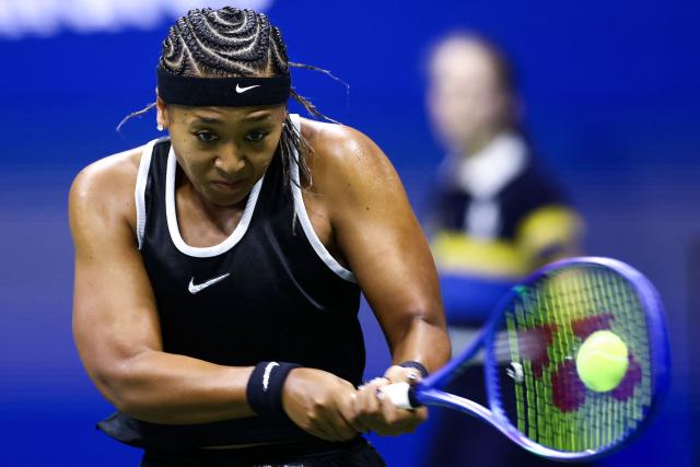 Japan's Naomi Osaka returns the ball to Russia's Anastasia Zakharova (off frame) during the women's singles first round tennis match on day two of the US Open tennis tournament at the USTA Billie Jean King National Tennis Center in New York City on August 31, 2026. (Photo by CHARLY TRIBALLEAU / AFP)