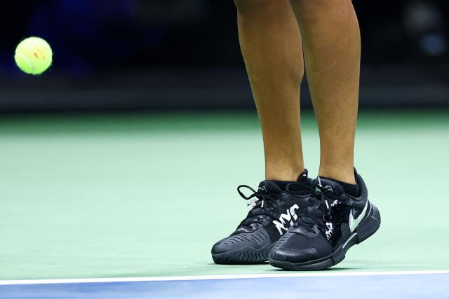 Japan's Naomi Osaka (detail shoes) returns the ball to Russia's Anastasia Zakharova (off frame) during the women's singles first round tennis match on day two of the US Open tennis tournament at the USTA Billie Jean King National Tennis Center in New York City on August 31, 2026. (Photo by CHARLY TRIBALLEAU / AFP)