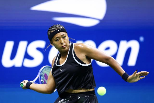 Japan's Naomi Osaka returns the ball to Russia's Anastasia Zakharova (off frame) during the women's singles first round tennis match on day two of the US Open tennis tournament at the USTA Billie Jean King National Tennis Center in New York City on August 31, 2026. (Photo by CHARLY TRIBALLEAU / AFP)