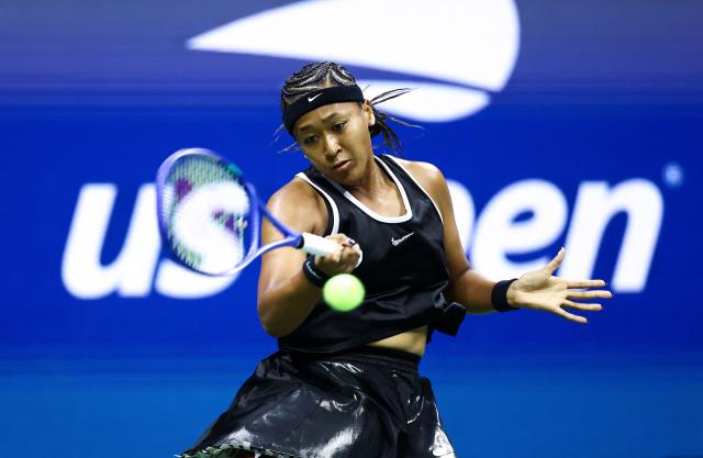 Japan's Naomi Osaka returns the ball to Russia's Anastasia Zakharova (off frame) during the women's singles first round tennis match on day two of the US Open tennis tournament at the USTA Billie Jean King National Tennis Center in New York City on August 31, 2026. (Photo by CHARLY TRIBALLEAU / AFP)