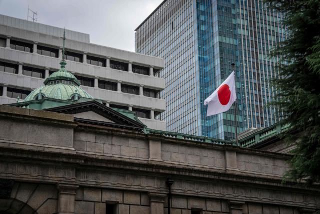 The Japanese national flag is seen at the Bank of Japan (BoJ) headquarters in Tokyo on September 1, 2026. (Photo by Yuichi YAMAZAKI / AFP)
