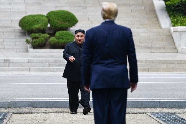 (FILES) North Korea's leader Kim Jong Un walks to greet US President Donald Trump at the Military Demarcation Line that divides North and South Korea, in the Joint Security Area (JSA) of Panmunjom in the Demilitarized zone (DMZ) on June 30, 2019. A summit between the United States and North Korea appears possible "at any time" as signs have emerged of dialogue between them, a lawmaker citing South Korea's spy agency said on September 1, 2026. US President Donald Trump has floated the idea of new meeting with North Korean leader Kim Jong Un, but has mostly been met with silence in public from Pyongyang. (Photo by Brendan Smialowski / AFP)