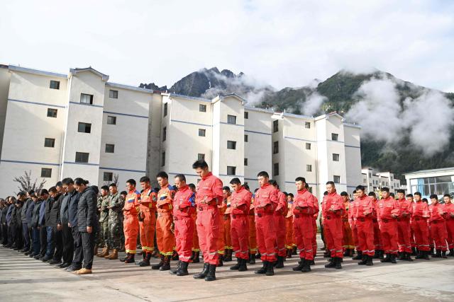 Mourners attend a memorial service for victims of a mudslide at the Gyirong Port police station in Gyirong County, in China’s western Tibet region on September 1, 2026. (Photo by CNS / AFP) / China OUT