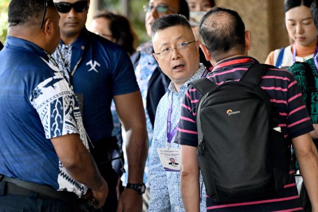 China’s special envoy for Pacific Affairs Qian Bo (C) leaves after attending the 55th Pacific Islands Forum Leaders Meeting in Koror on September 1, 2026. (Photo by SAEED KHAN / AFP)