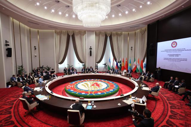 In this pool photograph distributed by the Russian state agency Sputnik, Russia's President Vladimir Putin and other leaders attend the Shanghai Cooperation Organisation (SCO) summit in Bishkek on September 1, 2026. (Photo by Peter KOVALEV / POOL / AFP)