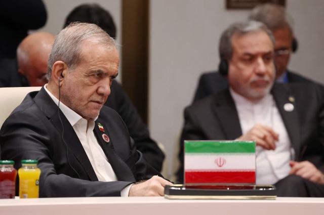 In this pool photograph distributed by the Russian state agency Sputnik, Iran's President Masoud Pezeshkian attends the Shanghai Cooperation Organisation (SCO) summit in Bishkek on September 1, 2026. (Photo by Vyacheslav PROKOFYEV / POOL / AFP)