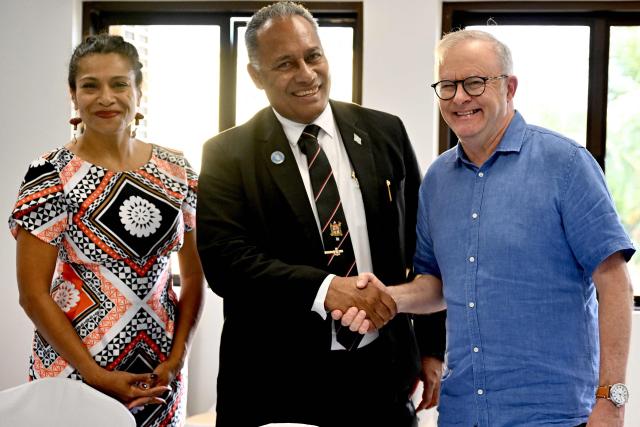 Australia's Prime Minister Anthony Albanese (R) shakes hands with Fiji's Minister for Foreign Affairs Sakiasi Ditoka (C) on the start of a trilateral meeting during the 55th Pacific Islands Forum Leaders Meeting in Koror on September 1, 2026. (Photo by SAEED KHAN / AFP)