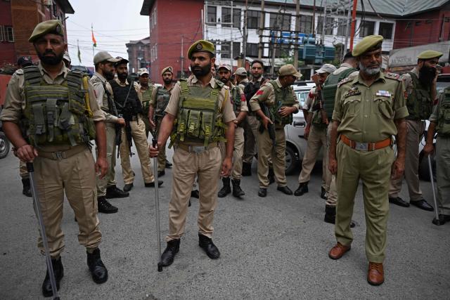 Indian police personnel stand guard as Jammu and Kashmir Apni Party supporters protest against the government in Srinagar on September 1, 2026. (Photo by TAUSEEF MUSTAFA / AFP)