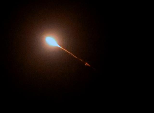 This photograph shows a flying missile during a Russian aerial attack in Kyiv early on September 1, 2026, amid the Russian invasion of Ukraine. A "massive" Russian missile and drone attack on Kyiv and its surrounding areas killed at least four people and wounded more than a dozen others, Ukrainian officials said on September 1. The strikes came as children were set to return to school after the summer holidays and officials tightened security measures during fears of further Russian strikes. (Photo by Sergei SUPINSKY / AFP)