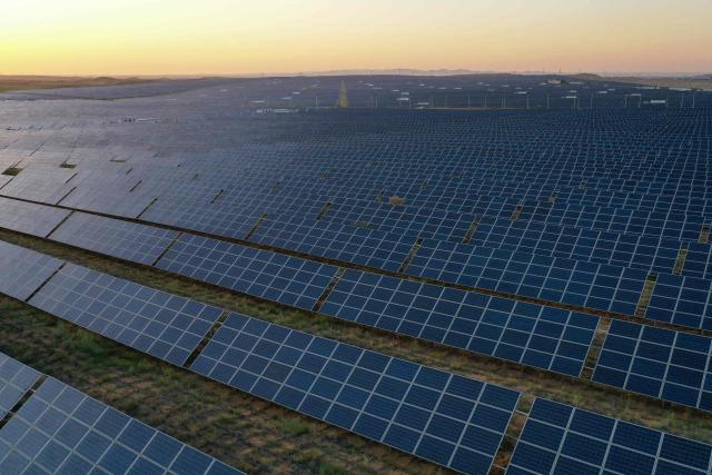 (FILES) Solar panels are seen at the Tengger Desert Solar Park in China's northern Ningxia region on August 21, 2024. China's installed solar energy capacity has surpassed that of coal-fired power for the first time, the national energy body said on September 1, 2026, hailing the milestone. (Photo by GREG BAKER / AFP)
