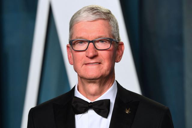 (FILES) CEO of Apple Tim Cook attends the 2022 Vanity Fair Oscar Party following the 94th Oscars at the The Wallis Annenberg Center for the Performing Arts in Beverly Hills, California on March 27, 2022. Apple's chief executive Tim Cook hands over the company's reins to it's vice president of hardware engineering John Ternus on September 1, 2026. Cook spent nearly three decades at Apple, which he has led as CEO since 2011. (Photo by Patrick T. FALLON / AFP)