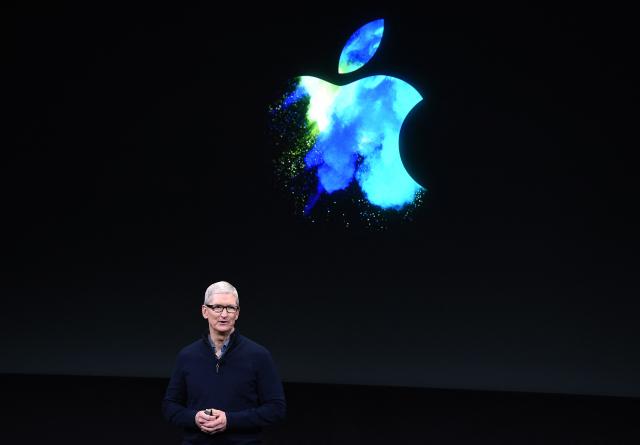 (FILES) Apple CEO Tim Cook speaks during a product launch event at Apple headquarters in Cupertino, California on October 27, 2016. Apple's chief executive Tim Cook hands over the company's reins to it's vice president of hardware engineering John Ternus on September 1, 2026. Cook spent nearly three decades at Apple, which he has led as CEO since 2011. (Photo by Josh Edelson / AFP)