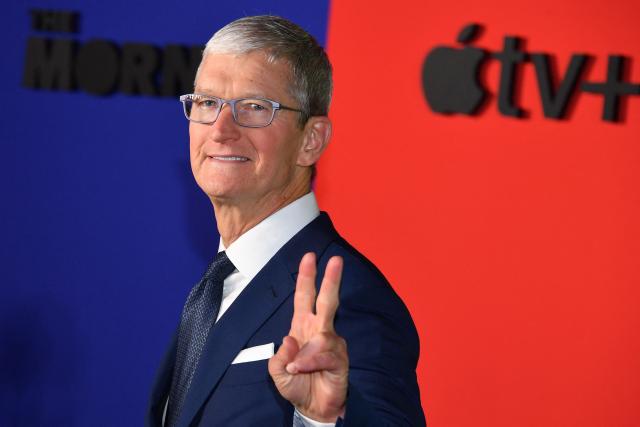 (FILES) Apple CEO Tim Cook arrives for Apple’s “The Morning Show” global premiere at Lincoln Center- David Geffen Hall on October 28, 2019 in New York. Apple's chief executive Tim Cook hands over the company's reins to it's vice president of hardware engineering John Ternus on September 1, 2026. Cook spent nearly three decades at Apple, which he has led as CEO since 2011. (Photo by ANGELA WEISS / AFP)