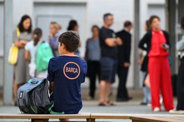 A pupil sits on a bench  in the yard on the first day of school at the Errobi secondary school in Cambo-les-Bains, south-western France on September 1, 2026. (Photo by Gaizka IROZ / AFP)