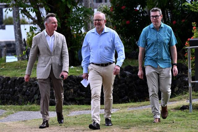 Australia's Prime Minister Anthony Albanese (C) walks with Australia's Minister for Climate Change and Energy Chris Bowen (L) and the Minister for Defence Industry Pat Conroy (R) to a press conference at the 55th Pacific Islands Forum Leaders Meeting in the capital city of Koror in Palau on September 1, 2026. (Photo by SAEED KHAN / AFP)