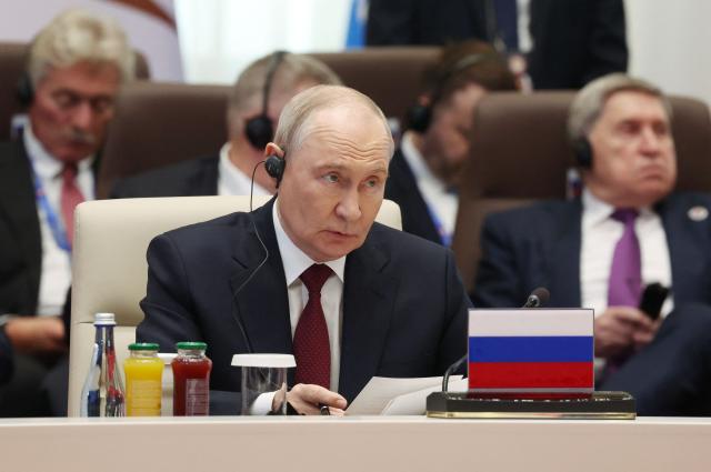 In this pool photograph distributed by the Russian state agency Sputnik, Russia's President Vladimir Putin attends a SCO+ format meeting of the Shanghai Cooperation Organisation (SCO) summit in Bishkek on September 1, 2026. (Photo by Vyacheslav PROKOFYEV / POOL / AFP)