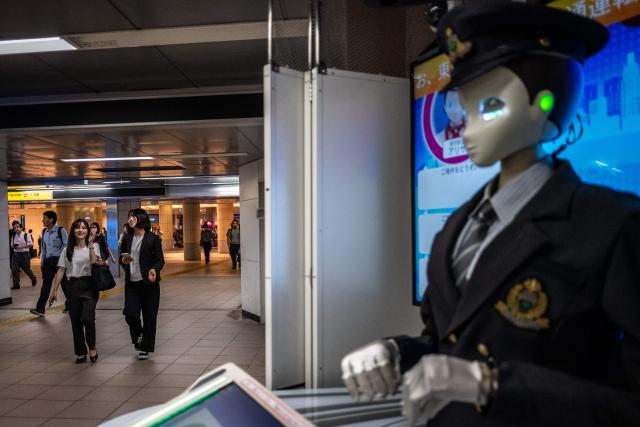 People walk through Shimbashi metro station in Tokyo on September 1, 2026. (Photo by Philip FONG / AFP)