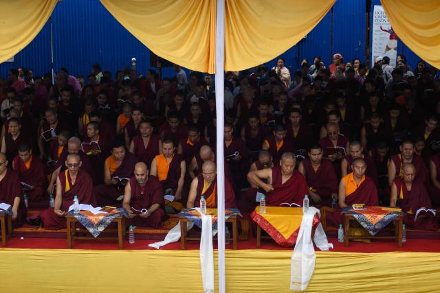 Buddhist monks offer prayers during a vigil to pay tribute to the flash flood victims at the Boudhanath Stupa in Kathmandu on September 1, 2026. (Photo by Manan VATSYAYANA / AFP)