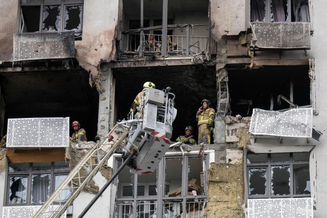 Rescuers operate at the site of a heavily damaged residential building following a Russian strike in Kyiv on September 1, 2026, amid the Russian invasion of Ukraine. Russia launched a barrage of drones and ballistic missiles at Kyiv and its surrounding region overnight, killing at least 12 people and wounding 21, Ukraine said on September 1, 2026, hitting the capital as children were set to return to school after the summer. (Photo by Vladyslav Musiienko / AFP)