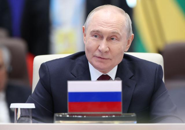 In this pool photograph distributed by the Russian state agency Sputnik, Russia's President Vladimir Putin attends a SCO+ format meeting of the Shanghai Cooperation Organisation (SCO) summit in Bishkek on September 1, 2026. (Photo by Peter KOVALEV / POOL / AFP)