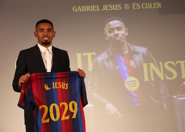 Brazilian forward Gabriel Jesus holds his jersey during his official presentation as FC Barcelona's new player on September 1, 2026 in Barcelona. Barcelona signed Brazilian forward Gabriel Jesus from Arsenal on a deal until 2029. (Photo by Lluis GENE / AFP)
