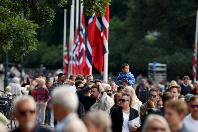 People line up to pay their respects to Norway's late King Harald V whose casket lies in state at the Royal Palace Chapel in Oslo, Norway, on September 1, 2026. Haakon VIII of Norway became king when his father King Harald V died in the morning of August 28 aged 89. (Photo by Odd ANDERSEN / AFP)