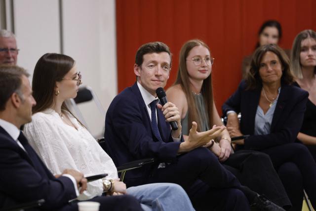 France's Minister of Education Edouard Geffray speaks with students during a visit to the INSPE University on the first day of the new academic year in Mende, southern France on September 1, 2026. Some 11.6 million primary, middle and secondary school pupils are returning to school on September 1, 2026, with headteachers' preparations having been disrupted by the fallout from a cyberattack targeting the French Ministry of Education this summer. Among the main changes this year are a ban on mobile phones in sixth-form colleges and the distribution to all pupils, from the final year of nursery school to the final year of sixth form, of a questionnaire on gender-based and sexual violence. (Photo by Guillaume HORCAJUELO / POOL / AFP)