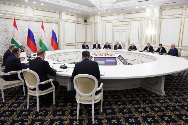 In this pool photograph distributed by the Russian state agency Sputnik, Russia's President Vladimir Putin and Tajikistan's President Emomali Rakhmon hold a meeting on the sidelines of the Shanghai Cooperation Organisation (SCO) summit in Bishkek on September 1, 2026. (Photo by Vyacheslav PROKOFYEV / POOL / AFP)