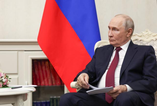 In this pool photograph distributed by the Russian state agency Sputnik, Russia's President Vladimir Putin attends a meeting with Turkey's President on the sidelines of the Shanghai Cooperation Organisation (SCO) summit in Bishkek on September 1, 2026. (Photo by Vyacheslav PROKOFYEV / POOL / AFP)