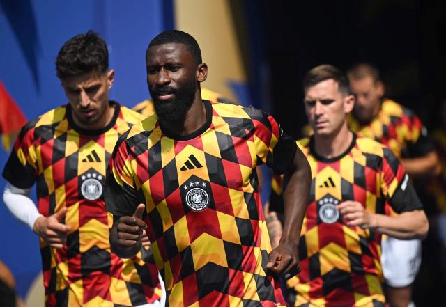 (FILES) Germany's defender #02 Antonio Ruediger warms up ahead of the 2026 World Cup round of 32 football match between Germany and Paraguay at the Boston Stadium in Foxborough on June 29, 2026. Germany defender Antonio Rudiger on September 1, 2026 announced his international retirement, two months after last playing for Germany at the 2026 World Cup. The 33-year-old made 86 appearances for the four-time world champions. (Photo by MAURO PIMENTEL / AFP)