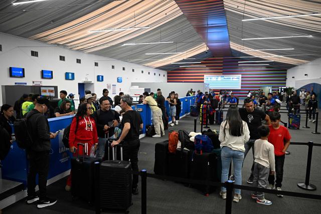 Passengers queue during the reopening of the Simon Bolivar International Airport in Maiquetia, state of La Guaira, Venezuela, on September 1, 2026, after being damaged by the June 24 twin earthquakes. (Photo by Federico PARRA / AFP)
