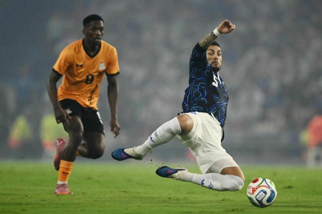 (FILES) Argentina's midfielder #05 Leandro Paredes (R) and Zambia's forward #09 Kingston Mutandwa (L) fight for the ball during a friendly football match between Argentina and Zambia at La Bombonera stadium in Buenos Aires on March 31, 2026. The news of Lionel Messi's retirement on August 31, 2026, from the Argentine national team did not come as a surprise to the Albiceleste, but the loss of their captain, star player, and all-time leading scorer has a huge impact on the future of the World Cup runner-up. (Photo by Luis ROBAYO / AFP)