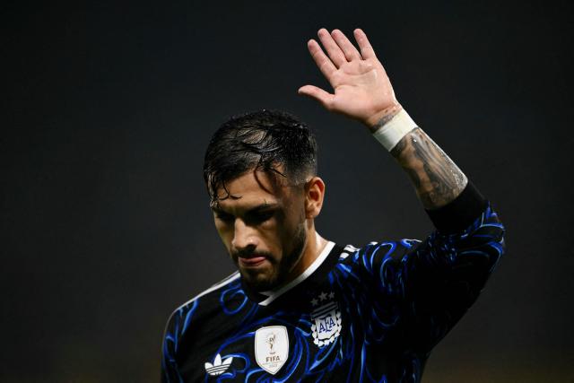 (FILES) Argentina's midfielder #05 Leandro Paredes waves to supporters during a friendly football match between Argentina and Zambia at La Bombonera stadium in Buenos Aires on March 31, 2026. The news of Lionel Messi's retirement on August 31, 2026, from the Argentine national team did not come as a surprise to the Albiceleste, but the loss of their captain, star player, and all-time leading scorer has a huge impact on the future of the World Cup runner-up. (Photo by Luis ROBAYO / AFP)