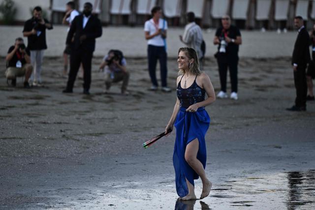 Italian actress Greta Scarano, who will conduct the Opening Ceremony of the 83rd Venice International Film Festival, poses during a photo call on the beach of the Excelsior Hotel at Lido di Venezia in Venice, Italy, on the eve of the festival's opening. (Photo by Tiziana FABI / AFP)