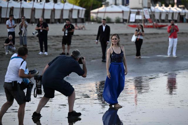 Italian actress Greta Scarano, who will conduct the Opening Ceremony of the 83rd Venice International Film Festival, poses during a photo call on the beach of the Excelsior Hotel at Lido di Venezia in Venice, Italy, on the eve of the festival's opening. (Photo by Tiziana FABI / AFP)
