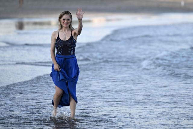 Italian actress Greta Scarano, who will conduct the Opening Ceremony of the 83rd Venice International Film Festival, poses during a photo call on the beach of the Excelsior Hotel at Lido di Venezia in Venice, Italy, on the eve of the festival's opening. (Photo by Tiziana FABI / AFP)