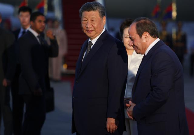 Chinese President Xi Jinping is welcomed by Egyptian President Abdel Fattah al-Sisi upon his arrival at Cairo International Airport for an official visit to Egypt, which is his first state visit to the country in 10 years, in Cairo on September 1, 2026. Chinese President Xi Jinping arrived in Egypt on September 1, 2026, making a rare trip to the Middle East as both countries face the threat of US sanctions over financial links to Iran. (Photo by Mohamed Abd El Ghany / POOL / AFP)