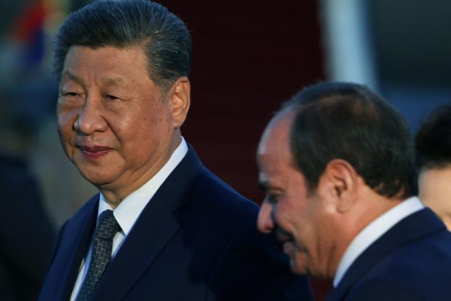 Chinese President Xi Jinping is welcomed by Egyptian President Abdel Fattah al-Sisi upon his arrival at Cairo International Airport for an official visit to Egypt, which is his first state visit to the country in 10 years, in Cairo on September 1, 2026. Chinese President Xi Jinping arrived in Egypt on September 1, 2026, making a rare trip to the Middle East as both countries face the threat of US sanctions over financial links to Iran. (Photo by Mohamed Abd El Ghany / POOL / AFP)