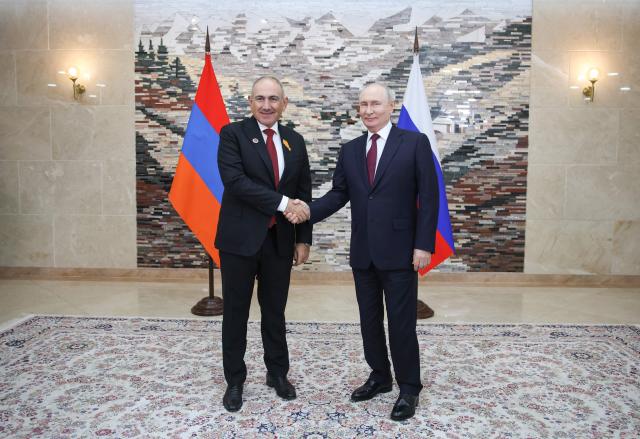 In this pool photograph distributed by the Russian state agency Sputnik, Russia's President Vladimir Putin and Armenian Prime Minister Nikol Pashinyan hold a meeting on the sidelines of the Shanghai Cooperation Organisation (SCO) summit in Bishkek on September 1, 2026. (Photo by Peter KOVALEV / POOL / AFP)