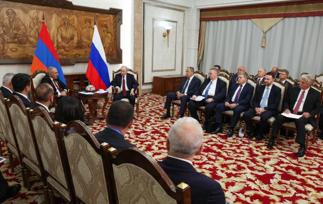 In this pool photograph distributed by the Russian state agency Sputnik, Russia's President Vladimir Putin and Armenian Prime Minister Nikol Pashinyan hold a meeting on the sidelines of the Shanghai Cooperation Organisation (SCO) summit in Bishkek on September 1, 2026. (Photo by Vyacheslav PROKOFYEV / POOL / AFP)