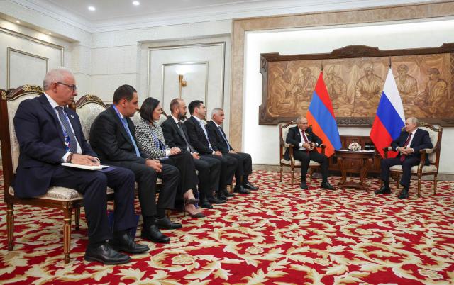 In this pool photograph distributed by the Russian state agency Sputnik, Russia's President Vladimir Putin and Armenian Prime Minister Nikol Pashinyan hold a meeting on the sidelines of the Shanghai Cooperation Organisation (SCO) summit in Bishkek on September 1, 2026. (Photo by Vyacheslav PROKOFYEV / POOL / AFP)