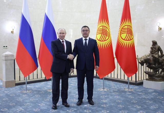 In this pool photograph distributed by the Russian state agency Sputnik, Russia's President Vladimir Putin and Kyrgyzstan's President Sadyr Japarov hold a meeting on the sidelines of the Shanghai Cooperation Organisation (SCO) summit in Bishkek on September 1, 2026. (Photo by Peter KOVALEV / POOL / AFP)
