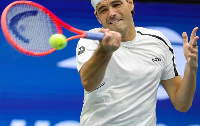 USA's Taylor Fritz hits a return to USA's Darwin Blanch during their men's singles first round tennis match on day three of the US Open tennis tournament at the USTA Billie Jean King National Tennis Center in New York City on September 1, 2026. (Photo by KENA BETANCUR / AFP)