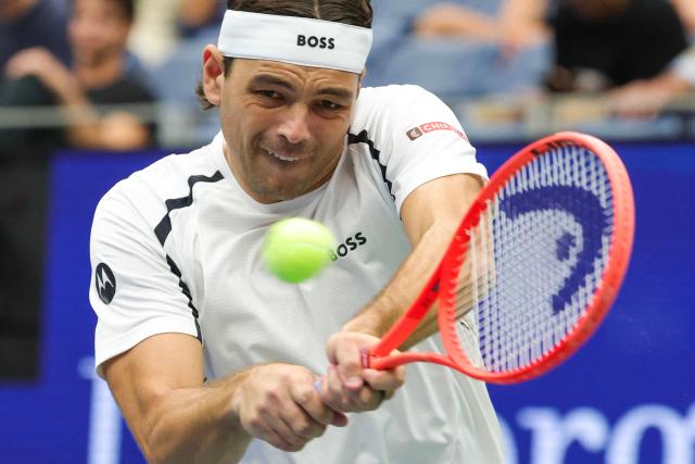 USA's Taylor Fritz plays a return against USA's Darwin Blanch during their men's singles first round tennis match on day three of the US Open tennis tournament at the USTA Billie Jean King National Tennis Center in New York City on September 1, 2026. (Photo by KENA BETANCUR / AFP)