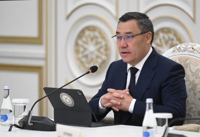 In this pool photograph distributed by the Russian state agency Sputnik, Kyrgyzstan's President Sadyr Japarov attends a meeting with Russia's President on the sidelines of the Shanghai Cooperation Organisation (SCO) summit in Bishkek on September 1, 2026. (Photo by Kristina Solovyova / POOL / AFP)